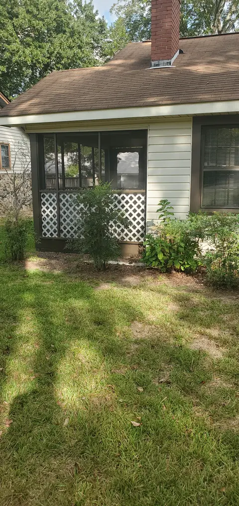 Screened porch seen from the side yard